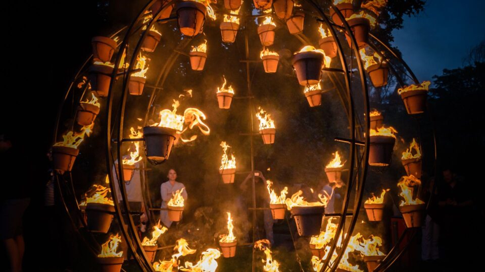 Plant pots alight as part of Cie Carabosse.