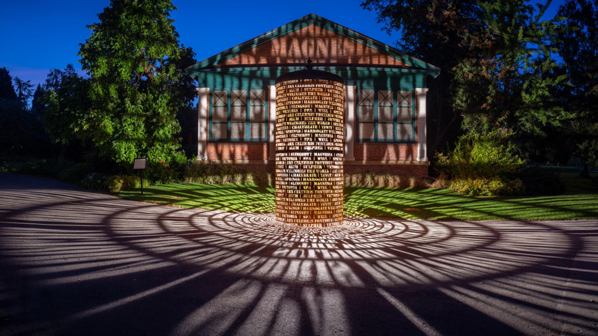 The Harrogate Spa installation lit up at night.