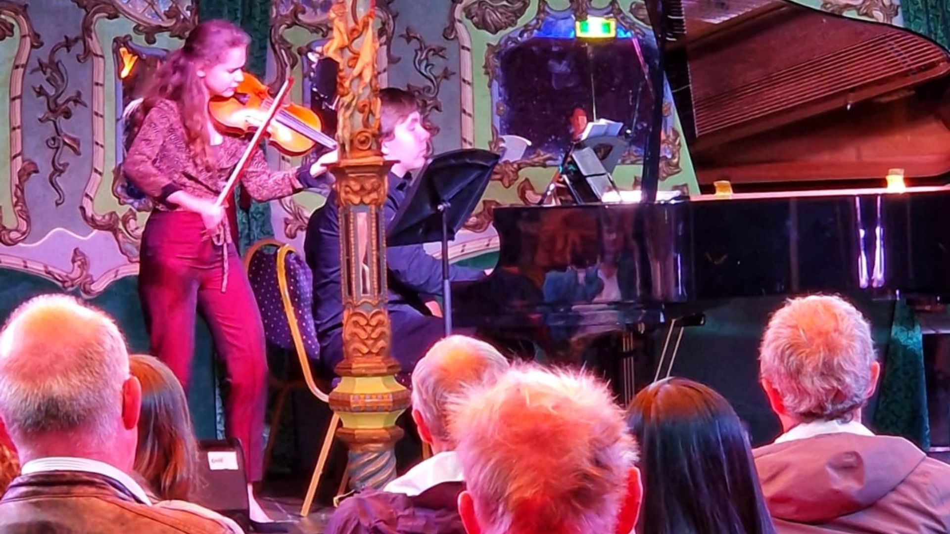 A young violinist onstage.
