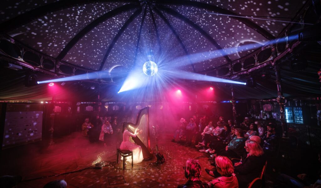Glow in the dark harp at Spiegeltent